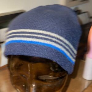 Blue Beanie with 3 grey stripes. One size fits all. Gently used